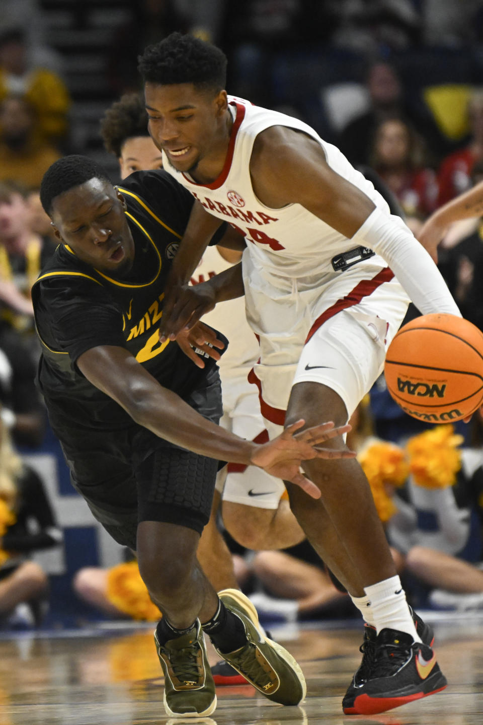 Missouri forward Mohamed Diarra, left, and Alabama forward Brandon Miller fend for the ball during the second half of an NCAA college basketball game in the semifinals of the Southeastern Conference Tournament, Saturday, March 11, 2023, in Nashville, Tenn. Alabama won 72-61. (AP Photo/John Amis)