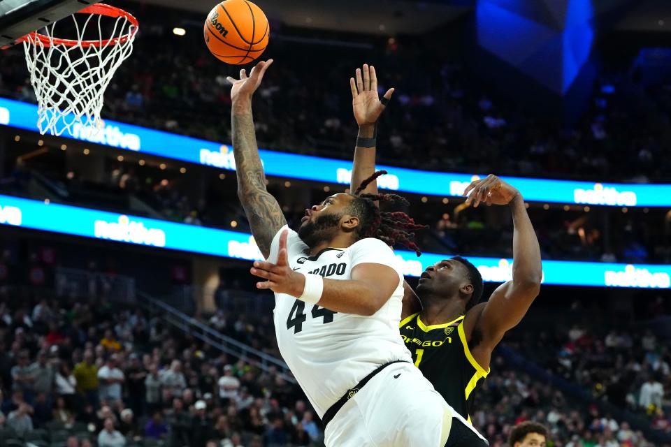 Colorado center Eddie Lampkin Jr. (44) shoots against Oregon center N'Faly Dante (1) during the first half at T-Mobile Arena in Las Vegas on March 16, 2024.