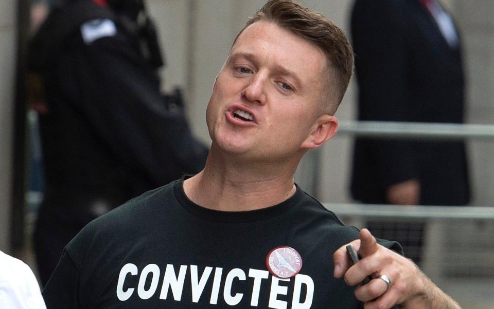 Tommy Robinson arriving at the Old Bailey in 2019 for contempt of court wearing a T-shirt that read 'convicted of journalism' - JULIAN SIMMONDS