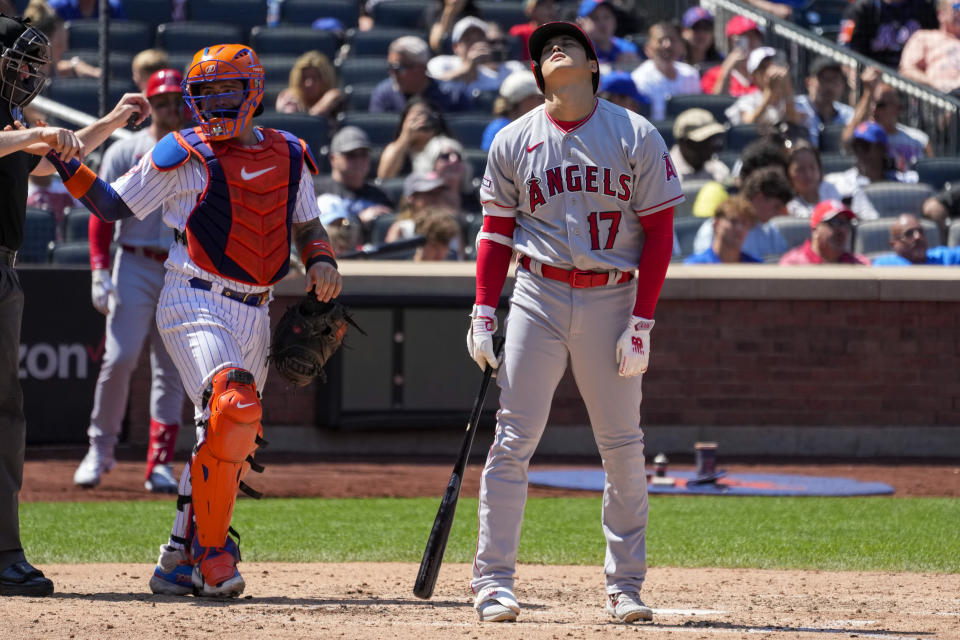 Los Angeles Angels designated hitter Shohei Ohtani reacts after foul tipping the ball off his foot during the sixth inning of a baseball game against the New York Mets, Sunday, Aug. 27, 2023, in New York. (AP Photo/Mary Altaffer)