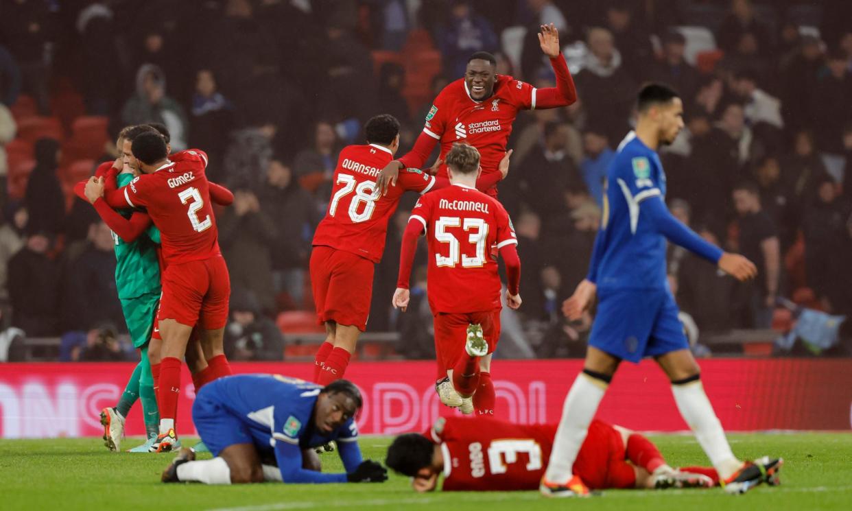 <span>Liverpool players celebrate victory and leave their Chelsea counterparts on the floor.</span><span>Photograph: Tom Jenkins/The Guardian</span>