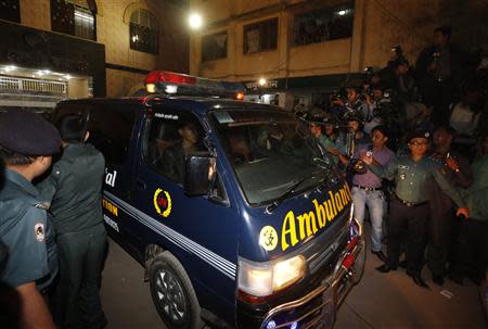 One of a convoy of three ambulances leave the central jail in Dhaka December 12, 2013. REUTERS/Andrew Biraj