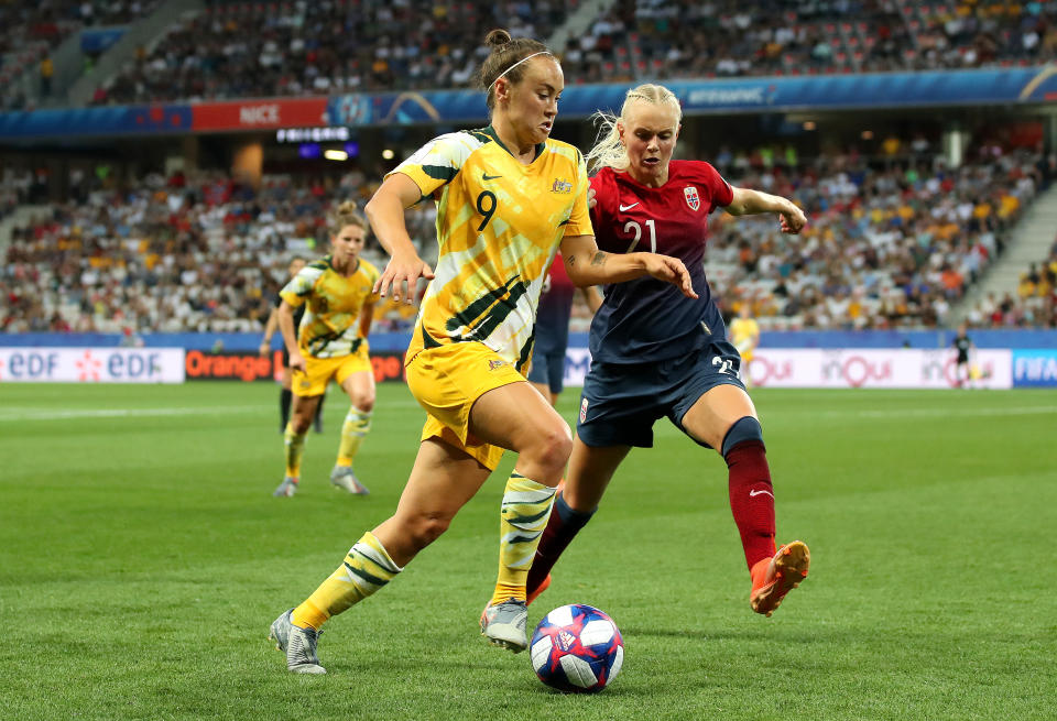 Caitlin Foord of Australia runs with the ball under pressure from Karina Saevik of Norway during the 2019 FIFA Women's World Cup France Round Of 16 match between Norway and Australia at Stade de Nice on June 22, 2019 in Nice, France. (Photo by Hannah Peters - FIFA/FIFA via Getty Images)