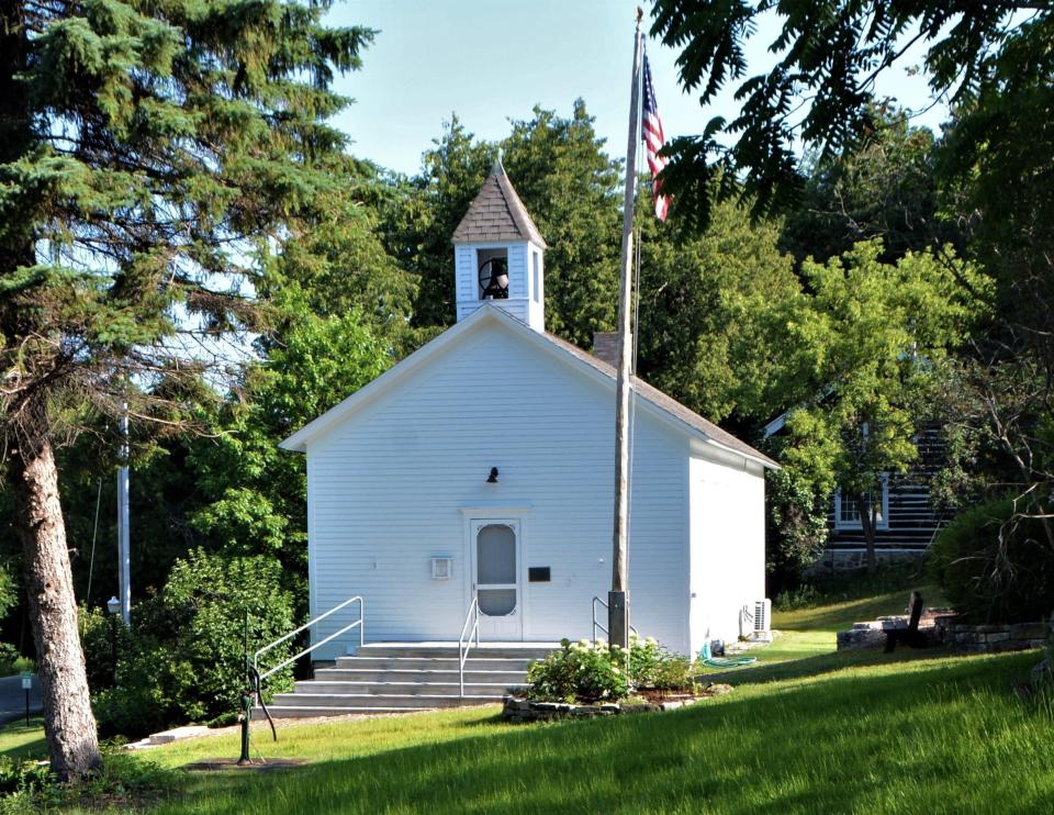 Pioneer Schoolhouse was built in the Village of Ephraim in 1880 and students in grades one through eight were taught there until it closed in 1949. It now is one of five museums operated by the Ephraim Historical Foundation.