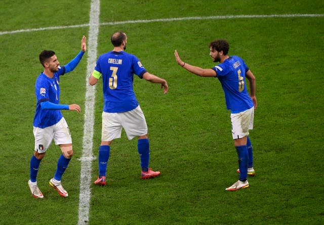 Lorenzo Pellegrini, left, celebrates scoring