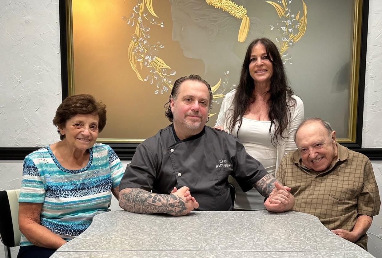 Tavolena chef/owner Michael Rolchigo (center) shares a portrait with his mother Juliet, his late father Phil. Rolchigo's wife Lisa stands at his side.