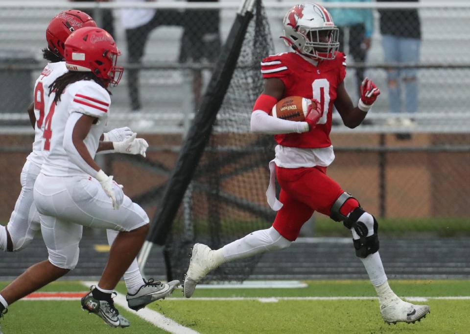 East's Ibraheem Kamara runs back a first-half interception for a touchdown against Chaney on Aug. 17.