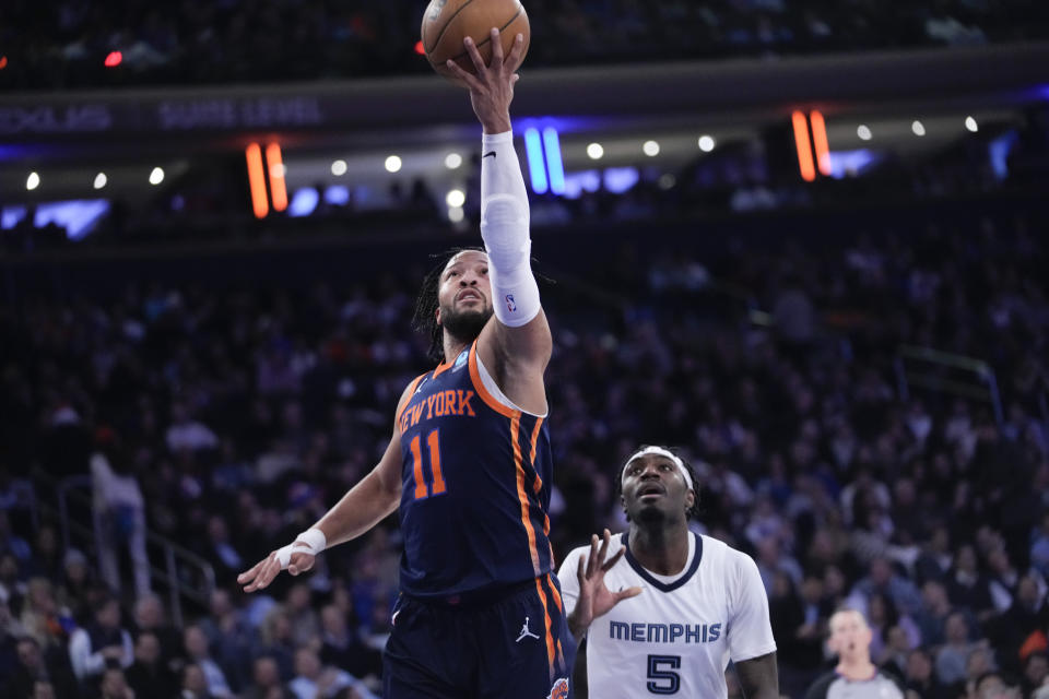 New York Knicks guard Jalen Brunson goes to the basket past Memphis Grizzlies guard Vince Williams Jr. (5) during the first half of an NBA basketball game, Tuesday, Feb. 6, 2024, at Madison Square Garden in New York. (AP Photo/Mary Altaffer)