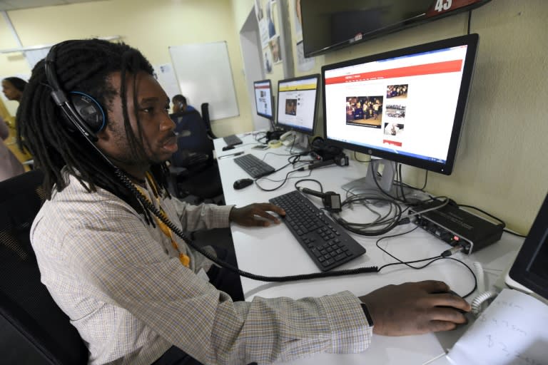 BBC programmer Busayo Iruemiode checks a website in Pidgin in Lagos, on August 18, 2017