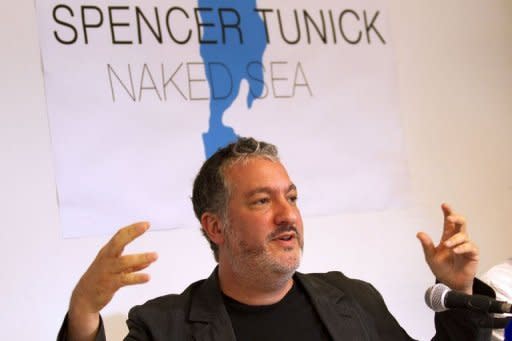 US art photographer Spencer Tunick addresses a news conference in Tel Aviv ahead of his trademark mass shoots of naked volunteers, this time at Israel's Dead Sea shoreline. Dawn over the lowest spot on earth illuminated a Dead Sea very much alive, as more than 1,000 floating nude Israelis posed for a mass shoot by Tunick