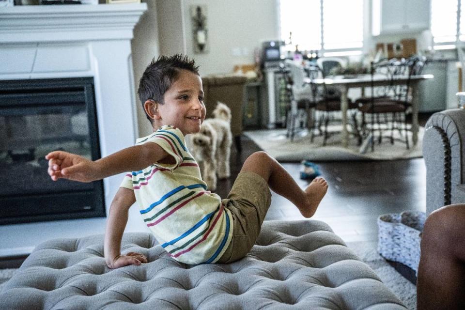 Six-year-old Jake Janes, who has lived with impaired hearing since birth, plays at his Rocklin home in July. His parents are lobbying to make hearing aids covered by medical providers for all California children.