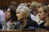 Unidentified family members of Oscar Pistorius listen to cross questioning about the events surrounding the shooting death of his girlfriend Reeva Steenkamp, in court during the second week of his trial in Pretoria, South Africa, Tuesday, March 11, 2014. Pistorius is charged with the shooting death of Steenkamp, on Valentines Day in 2013. (AP Photo/Kim Ludbrook, Pool)