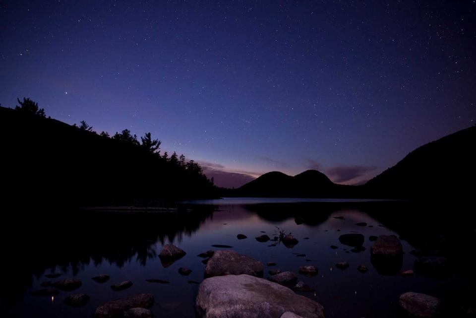 Jordan pond in Acadia National Park with night stars.