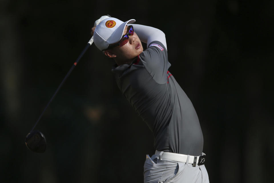 Jazz Janewattananond of Thailand tees off at the 18th hole at the Malaysia Golf Championship 2nd round in Kuala Lumpur, Malaysia, Friday, March 22, 2019. (AP Photo/Vincent Phoon)