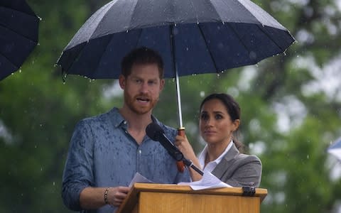 Prince Harry, Duke of Sussex and Meghan, Duchess of Sussex address the public during a Community Event at Victoria Park  - Credit: Ian Vogler/Getty