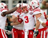 Taylor Martinez #3 of the Nebraska Cornhuskers celebrates a second quarter touchdown with teammates while playing the Michigan State Spartans at Spartan Stadium Stadium on November 3, 2012 in East Lansing, Michigan. (Photo by Gregory Shamus/Getty Images)