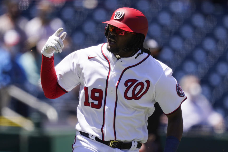 Washington Nationals' Josh Bell celebrates as he rounds the bases for his two-run homer during the first inning of a baseball game against the Philadelphia Phillies at Nationals Park, Thursday, May 13, 2021, in Washington. (AP Photo/Alex Brandon)