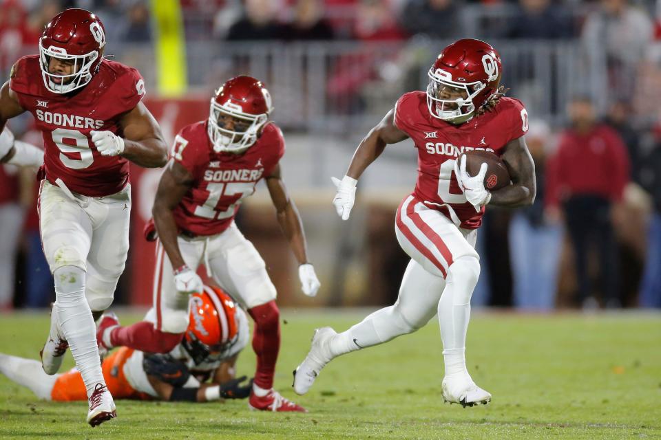 Oklahoma's Eric Gray (0) runs the ball during a Bedlam college football game between  the University of Oklahoma Sooners (OU) and the Oklahoma State University Cowboys (OSU) at Gaylord Family-Oklahoma Memorial Stadium in Norman, Okla., Saturday, Nov. 19, 2022. 