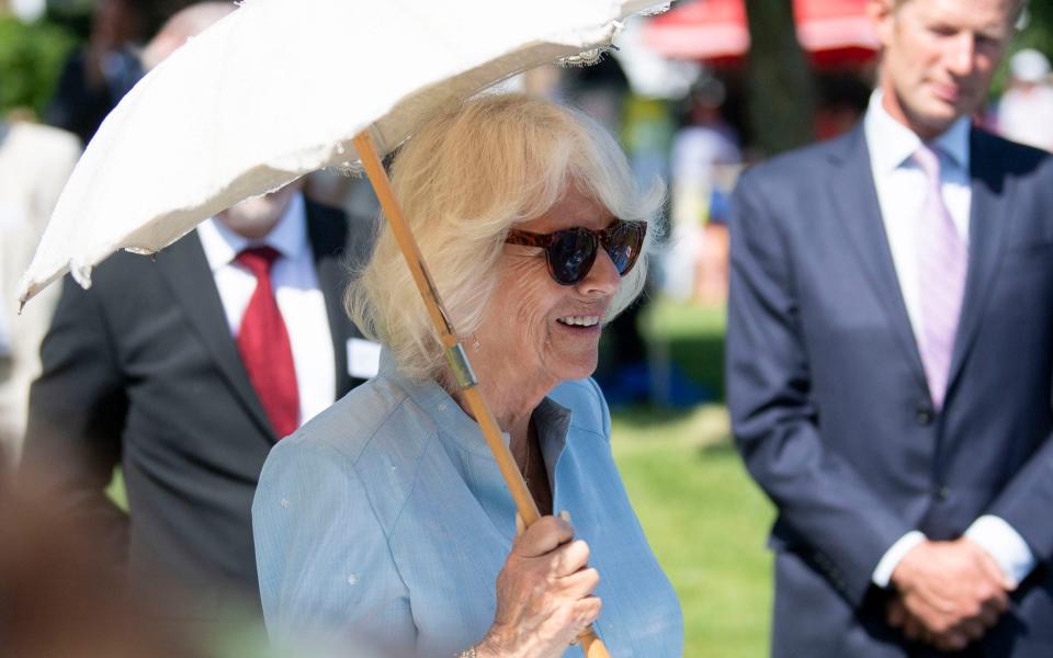 The Duchess of Cornwall, keeping out of the sun - David Rose/Daily Telegraph/PA Wire 