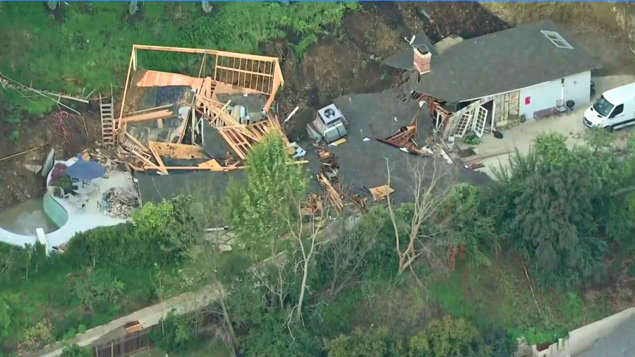 A home is red tagged after a mudslide in Sherman Oaks on March 13, 2024. (KTLA)