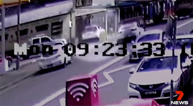 The stolen car jumps onto the footpath in 4WD. Source: 7 News