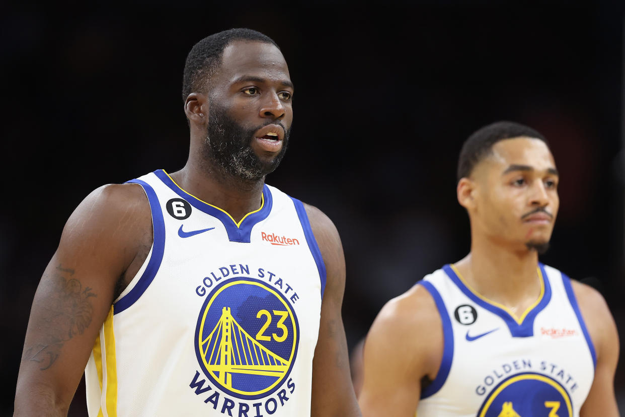 PHOENIX, ARIZONA - OCTOBER 25: (L-R) Draymond Green #23 and Jordan Poole #3 of the Golden State Warriors walk to the bench during the second half of the NBA game against the Phoenix Suns at Footprint Center on October 25, 2022 in Phoenix, Arizona. The Suns defeated the Warriors 134-105. (Photo by Christian Petersen/Getty Images)