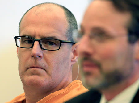 FILE PHOTO: Scott Dekraai (L), accused of killing eight people in a Seal Beach beauty salon in 2011, listens while his attorney Assistant Public Defender Scott Sanders addresses the court in Santa Ana March 18, 2014. REUTERS/Mark Boster/Los Angeles Times/Pool/File Photo