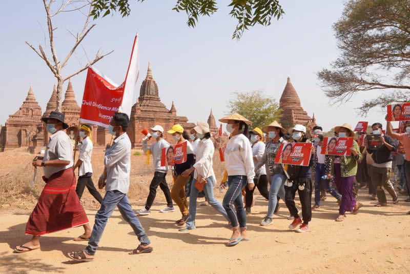 Demonstrators march during a protest against the military coup, near temples in Bagan