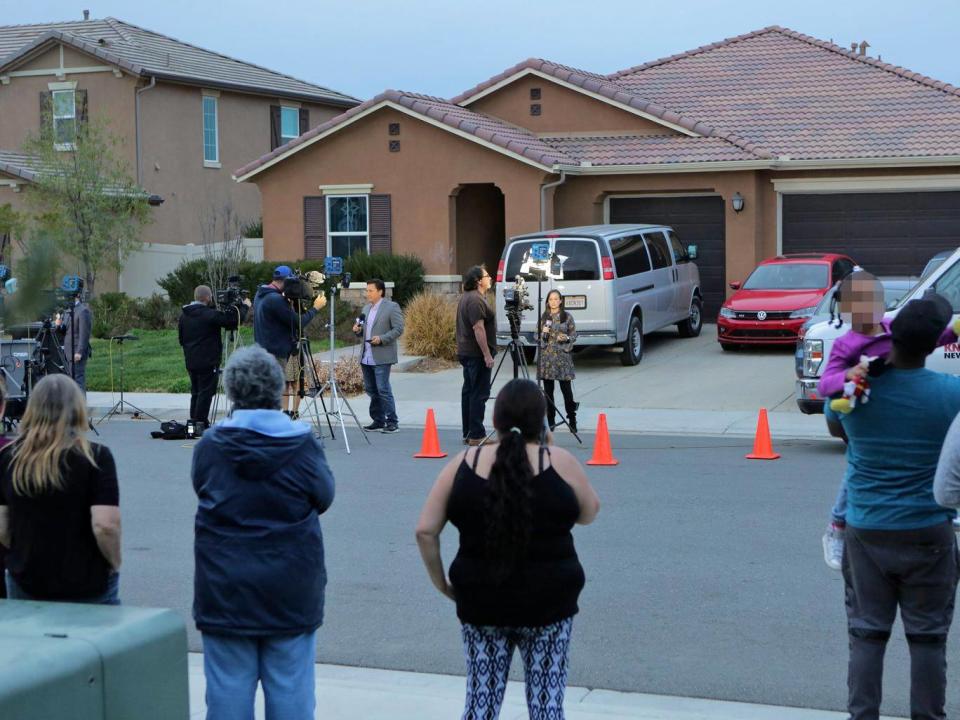 Perris residents watch as media gather in front of the Turpin's house (AFP/Getty)