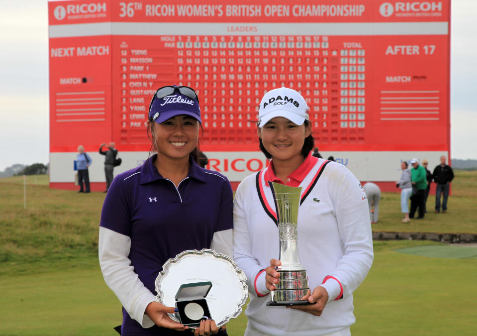 Danielle Kang and Yani Tseng pose with their trophies at the 2011 Ricoh Women’s British Open at Carnoustie Golf Links Scotland. (Photo by David Cannon/Getty Images)