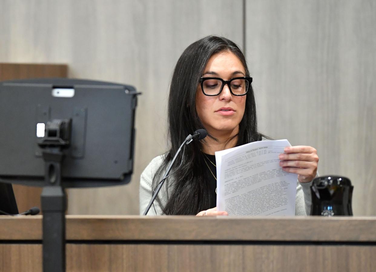 Dr. Beatriz Teppa-Sanchez, a critical care physician with Johns Hopkins All Children's Hospital, refers to her notes during testimony Thursday, Oct. 19, 2023 at the South County Courthouse in Venice, Florida, about the day that Maya Kowalski was admitted to the pediatric intensive care unit in October 2016. The Kowalski family is suing Johns Hopkins All Children's Hospital for false imprisonment, negligent infliction of emotional distress, medical negligence, battery, and other claims more than a year after the family matriarch, Beata Kowalski, took her life following allegations she was abusing her daughter, Maya Kowalski. Pool photo/Mike Lang/Sarasota Herald-Tribune