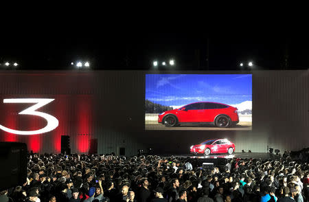 FILE PHOTO: Tesla introduces one of the first Model 3 cars off the Fremont factory's production line during an event at the company's facilities in Fremont, California, U.S. on July 28, 2017. REUTERS/Alexandria Sage/File Photo