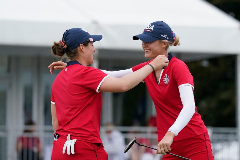 Ally Ewing, left, and Nelly Korda celebrate their win on the 18th green (Carlos Osorio/AP) (AP)