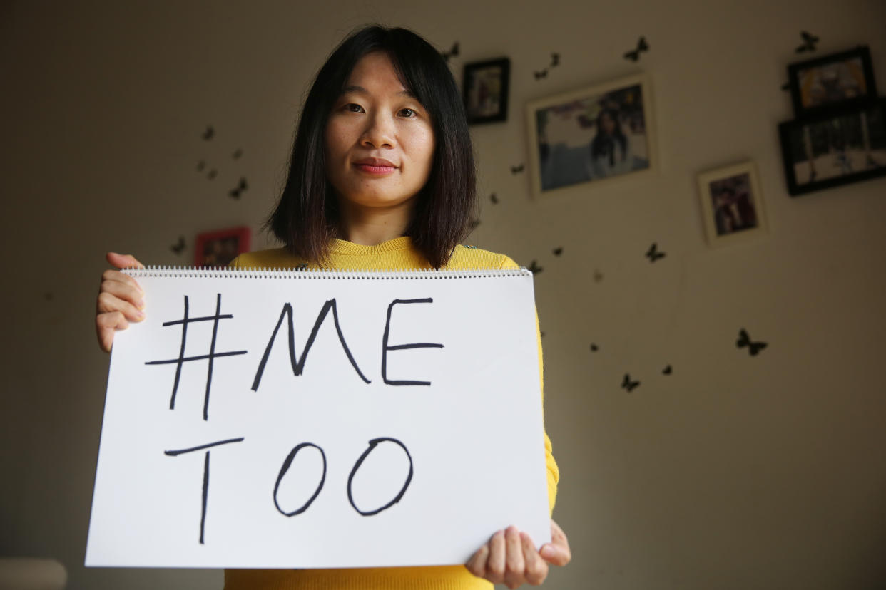 Sophia Huang Xueqin, a freelance journalist, poses with a #MeToo sign at her home. (Photo by Thomas Yau/South China Morning Post via Getty Images) 