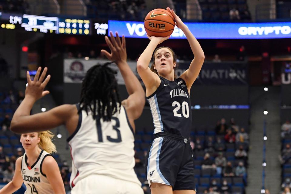 Villanova's Maddy Siegrist (20) shoots over Connecticut's Christyn Williams (13) in the first half of an NCAA college basketball game, Wednesday, Feb. 9, 2022, in Hartford, Conn. (AP Photo/Jessica Hill)