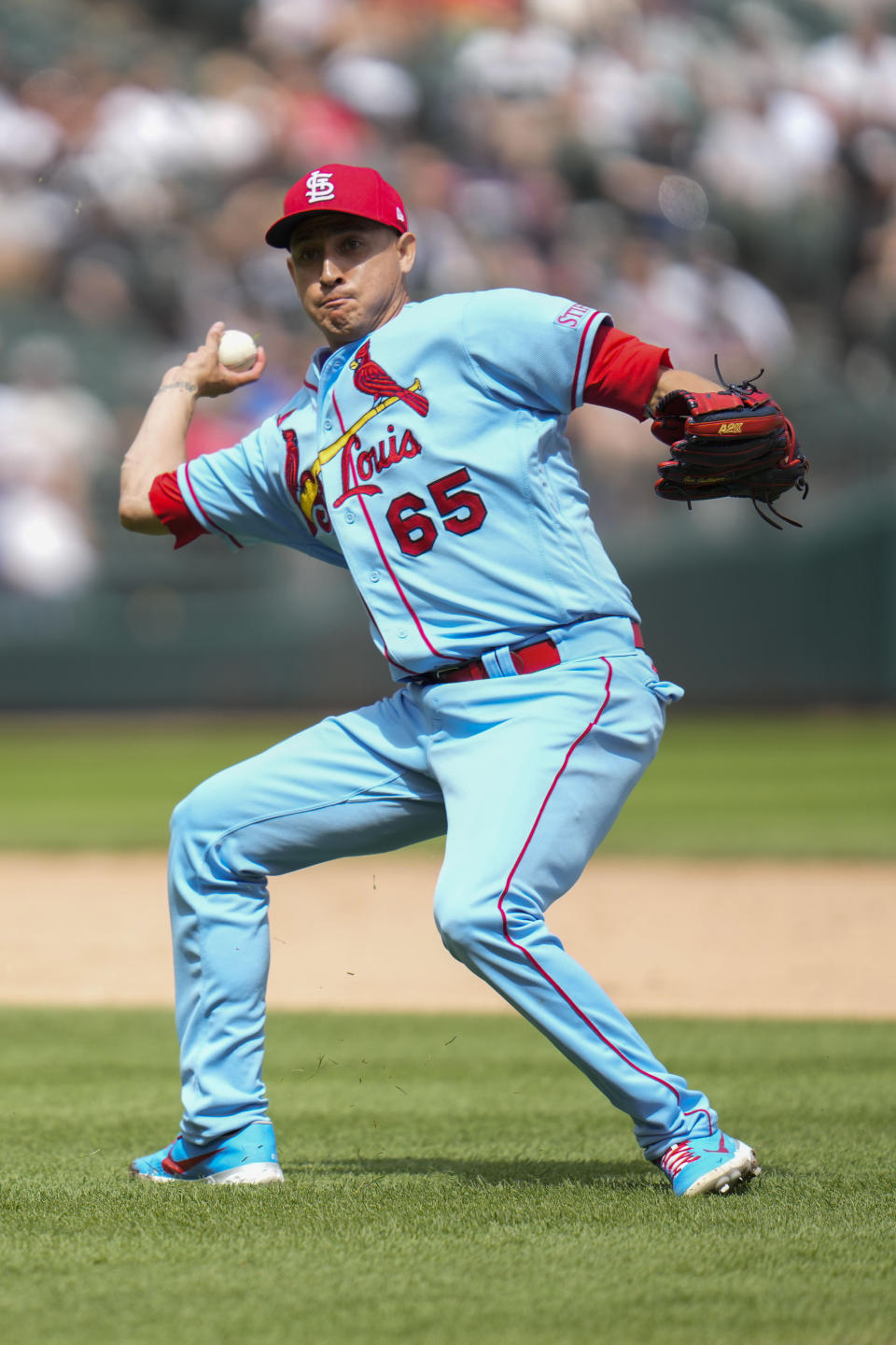St. Louis Cardinals relief pitcher Giovanny Gallegos throws to first during the eighth inning of a baseball game against the Chicago White Sox Saturday, July 8, 2023, in Chicago. (AP Photo/Erin Hooley)