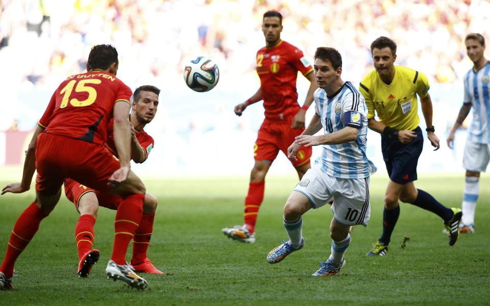 Argentina's Lionel Messi (10) fights for the ball with Belgium's Daniel Van Buyten (L) and Dries Mertens during their 2014 World Cup quarter-finals at the Brasilia national stadium in Brasilia July 5, 2014. REUTERS/Damir Sagolj