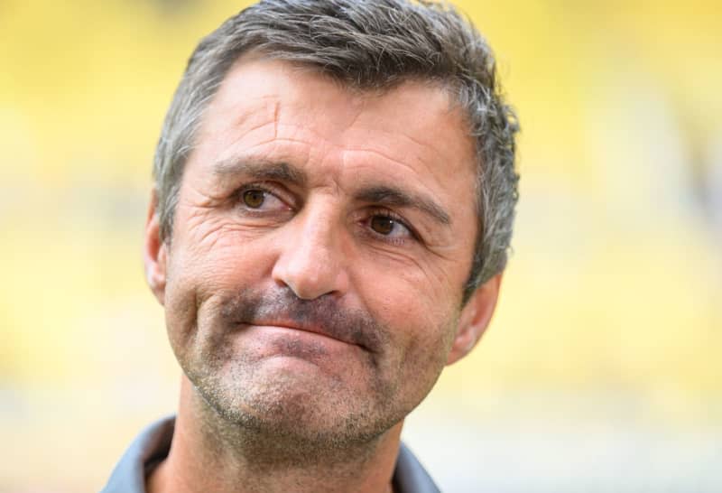 Ingolstadt coach Michael Köllner stands in the stadium during the German 3rd division soccer match between SG Dynamo Dresden and FC Ingolstadt 04 at Rudolf-Harbig-Stadion. Sabrina Wittmann has become the first-ever female coach in German men's professional football after being appointed interim coach at third division team Ingolstadt. Robert Michael/dpa