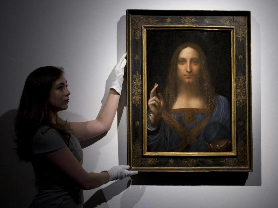 The Posin brothers have been copying the most expensive painting ever to have been sold at auction - Leonardo Da Vinci's 'Salvator Mundi' at Christie's New York (PA)