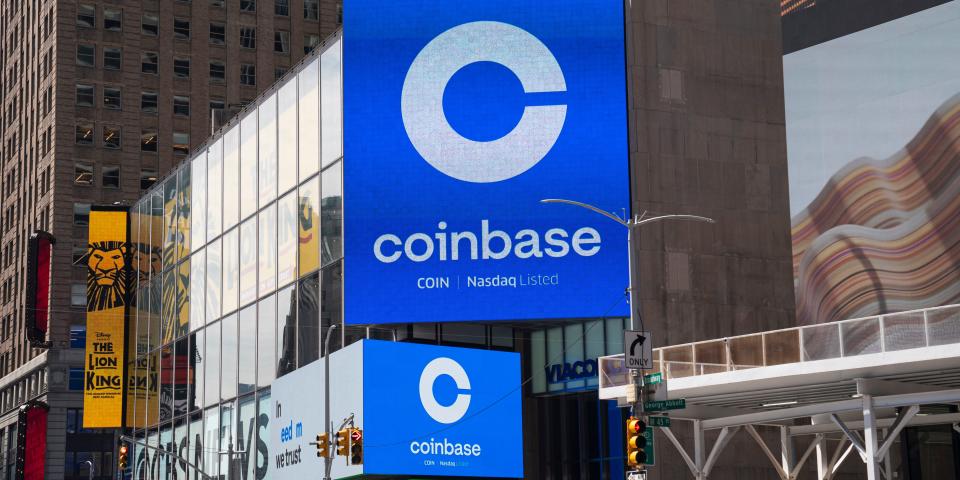 Monitors display Coinbase signage during the company's initial public offering at the Nasdaq market site April 14, 2021 in New York City.