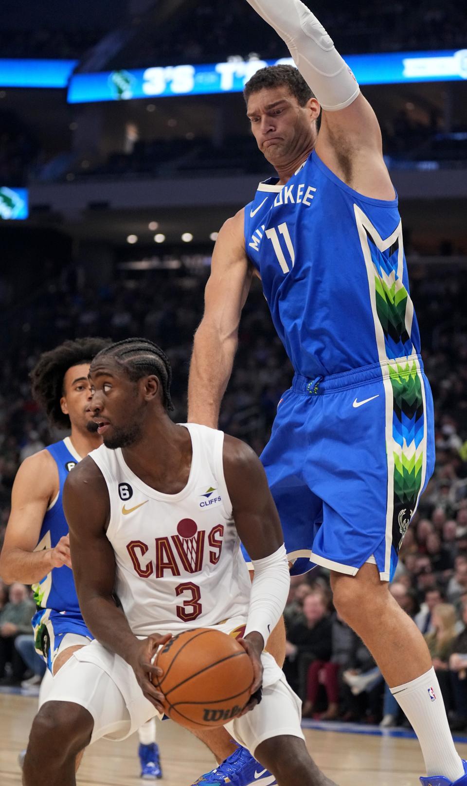 Bucks center Brook Lopez (11) defends Cleveland Cavaliers guard Caris LeVert.