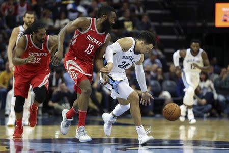 Nov 18, 2017; Memphis, TN, USA; Memphis Grizzlies guard Dillon Brooks (26) grabs the loose ball against Houston Rockets guard James Harden (13) during the third quarter at FedExForum. Mandatory Credit: Spruce Derden-USA TODAY Sports