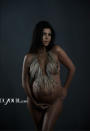 <p>Kourtney Kardashian posed while nine months pregnant for <em>DuJour</em> magazine.<br><em>[Photo: DuJour]</em> </p>