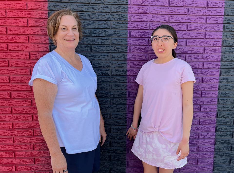 Jodi Cooper, left, and daughter Shelby Cooper are members of the board of directors for the Community Inclusion Club, a nonprofit in Iowa City. The organization hosts social events to encourage friendships between adults with and without disabilities.