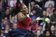 United States' Serena Williams returns a shot against Latvia's Anastasija Sevastova during a Fed Cup qualifying tennis match Saturday, Feb. 8, 2020, in Everett, Wash. (AP Photo/Elaine Thompson)