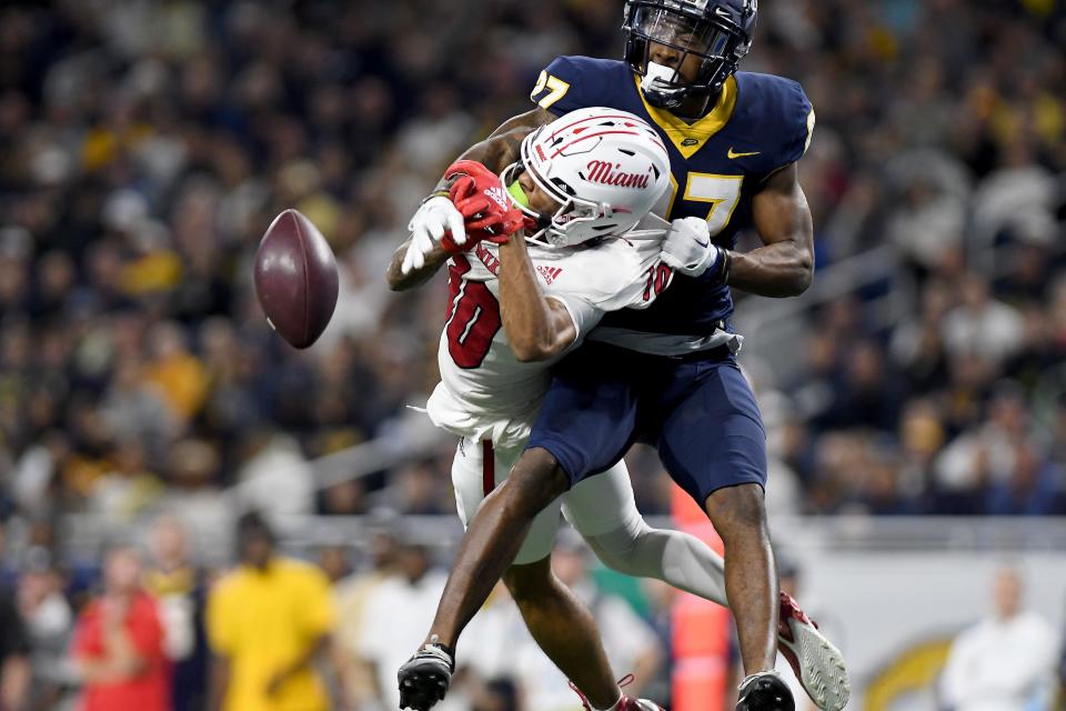 Dec 2, 2023; Detroit, MI, USA; Toledo Rockets cornerback Quinyon Mitchell (27) breaks up a pass intended for Miami (OH) Redhawks wide receiver Gage Larvadain (10) in the third quarter at Ford Field. Mandatory Credit: Lon Horwedel-USA TODAY Sports