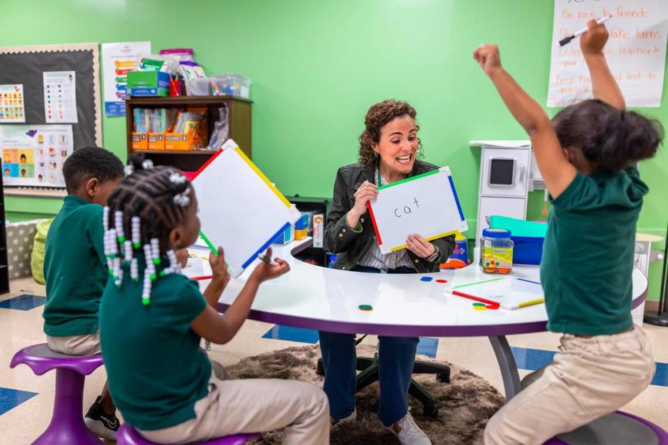 Paola Pilonieta, a UNC Charlotte Cato of College of Education professor, works with students at Niner Elementary on the campus of UNC Charlotte.