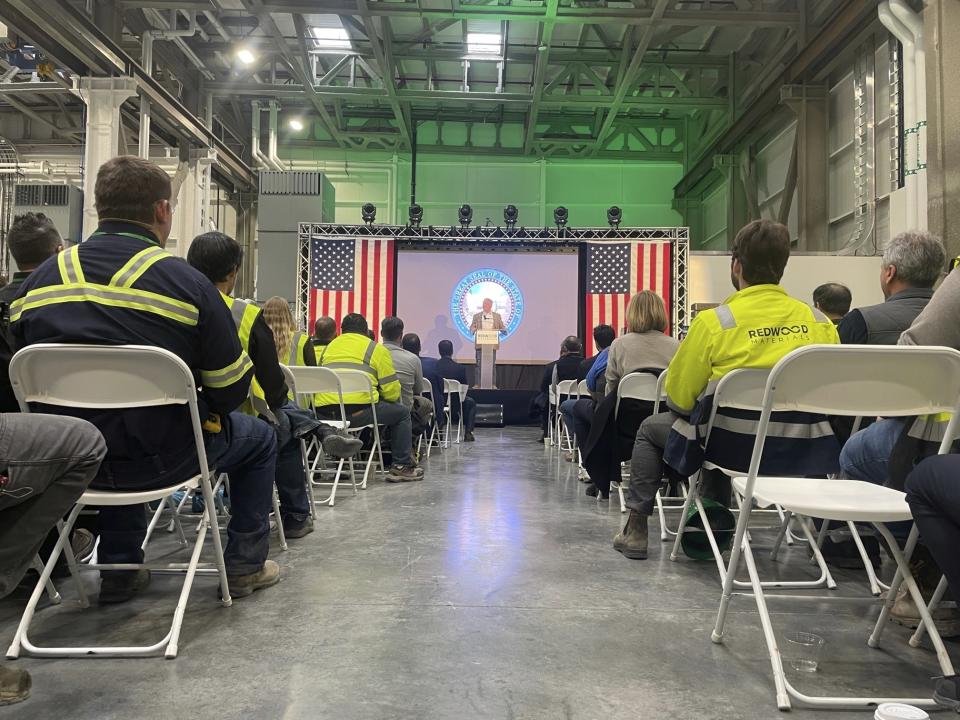 Nevada Gov. Joe Lombardo, on stage, speaks at Redwood Materials' facility in McCarran, Nevada, on Thursday, Feb. 9, 2023, after it was announced that Redwood Materials has won a $2 billion green energy loan from the Biden administration. (AP Photo/Gabe Stern)