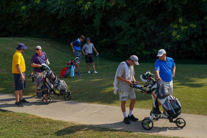 Participants wait to tee off on the 10th Holdens during the Evansville Men's City Golf Tournament qualifying round at Helfrich Hills Golf Course in Evansville, Ind., Saturday morning, July 2, 2022. 
