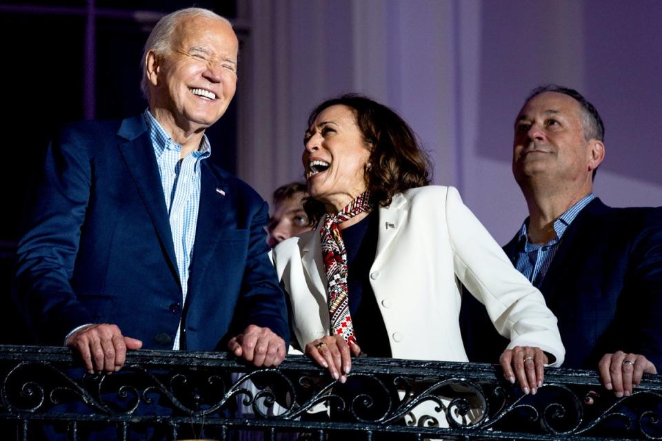 Harris is seen laughing with Biden during July 4 celebrations. Videos of her previous jokes are being shared across the internet as calls mount for her to take the reins for the elections. (EPA)